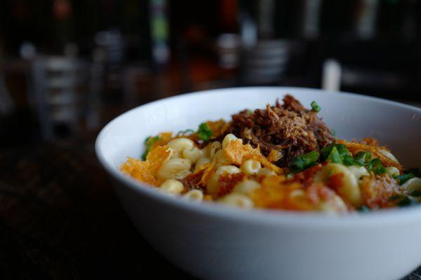 Enjoy our creamy Mac n Cheese made with Fields Premium Ale cheese sauce for a rich, savory experience, and topped with pork.