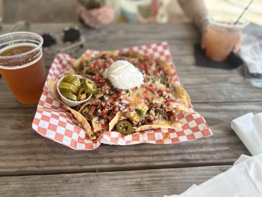 Nachos with ground beef loaded with meat, cheese, and toppings = amazingly good