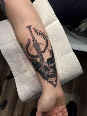 Demon Hunter tattoo with sword and Ephesians 6:12.