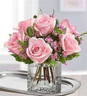 Love is in the air, with a beautiful arrangement of pink roses, sure to melt her heart.
