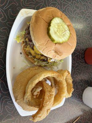 Jumbo cheeseburger yum with onion rings instead of fries.