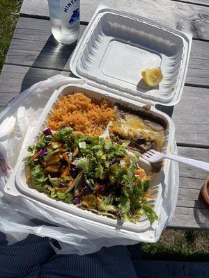 Shrimp tacos, rice and beans and a mineragua at the picnic tables.