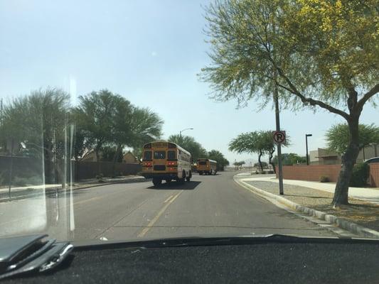 Busses blocking the street. Note the no parking sign