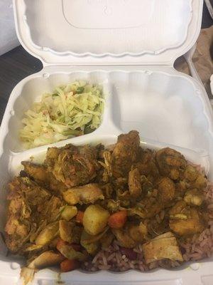 Large curry chicken with rice and peas and veggies