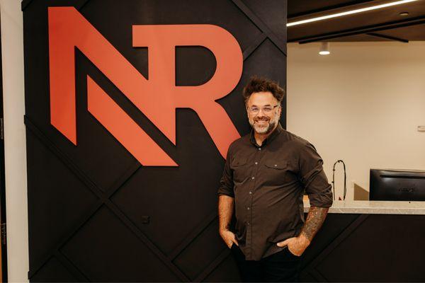 Here's a stellar picture of Tim waiting by the Nebraska Realty sign to help the next buyer or seller.