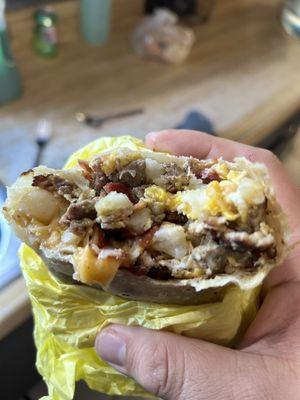 Steak, bacon ham and sausage breakfast burrito