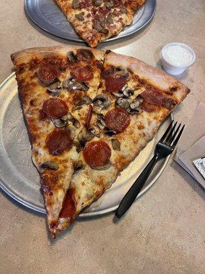 Pepperoni and mushroom. Fork to show size.