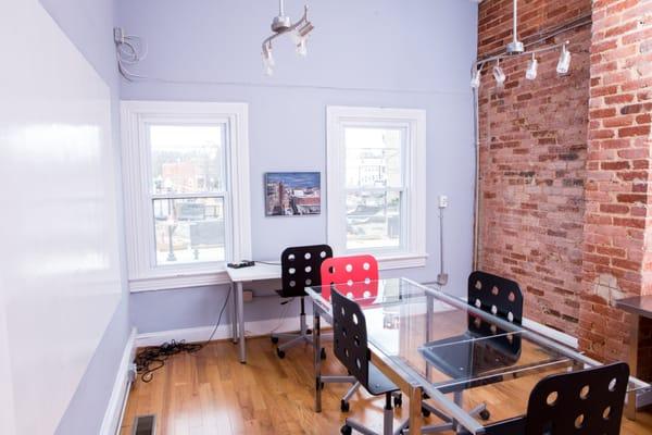 The conference room has a huge whiteboard and overlooks H St.