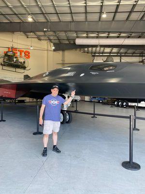 Standing in front of the SR-72 Darkstar Top Gun Maverick movie prop plane