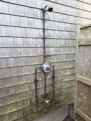 Outdoor shower with old Symmons valve that burst from not getting winterized properly