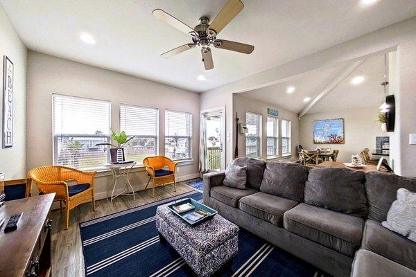 Living room is very bright and open. Sofa pulls out into queen bed.
Cheerful mood from all the windows.