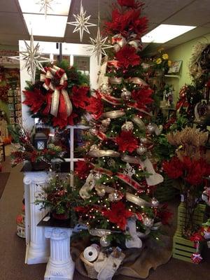 It looks like Christmas at Rainbow Florist! Need a wreath or centerpiece? Come see our beautiful selections.