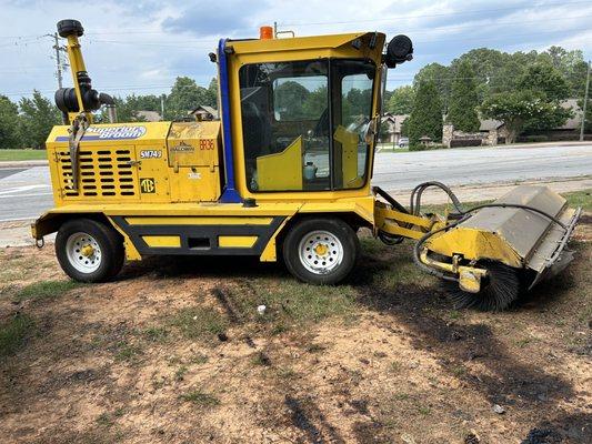 The street sweeper that threw the gravel.