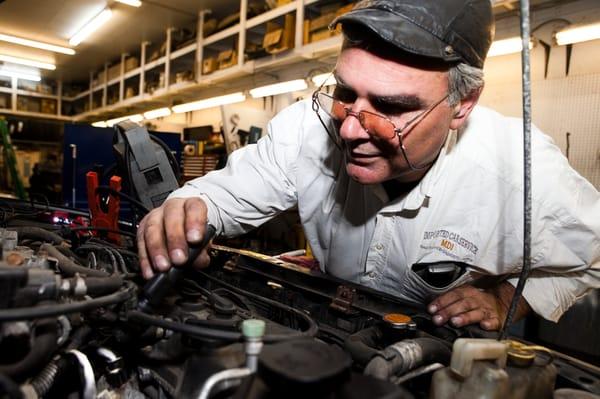 Over the Hood in a Funny Cap