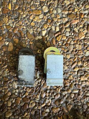 Old wheels removed -- rusted and broken parts before replacement.