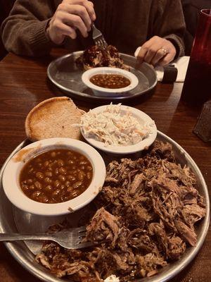 Pulled pork, baked beans, and coleslaw. Took 1/2 home for another meal.
