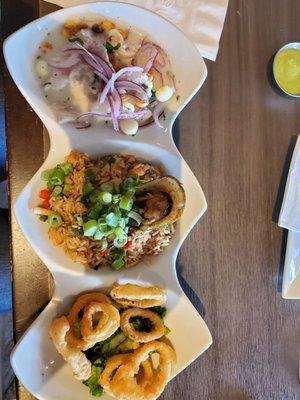 Trio with ceviche classico, calamari fried and seafood fried rice.