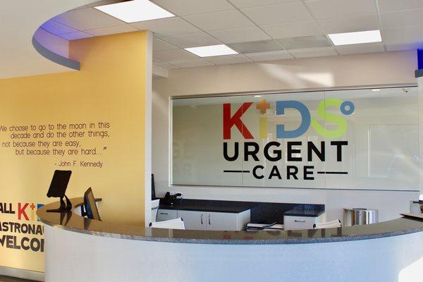 KIDS Urgent Care reception desk. Walk-ins welcome, or please book online at kidsurgent.care