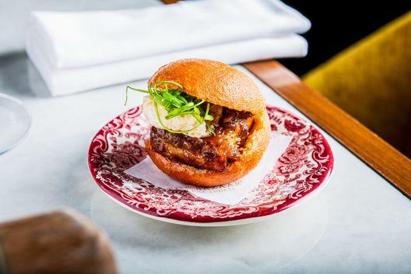 Bao con Lechon is a fried Chinese steam bun with pork belly