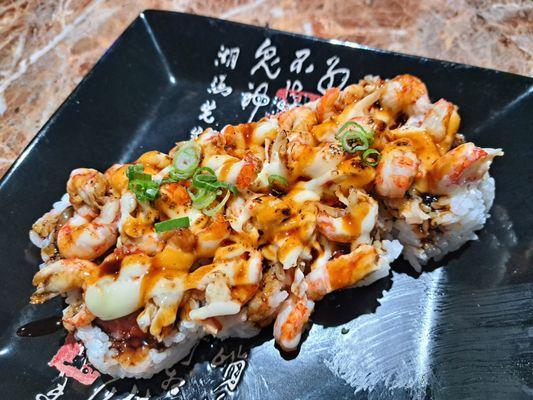 Party In Your Mouth roll has spicy tuna, scallops, and crawfish.