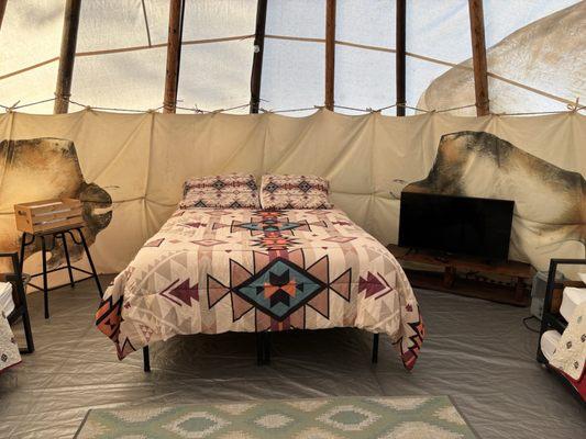 Inside of teepee. One queen and two twin beds.
