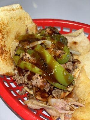 Morrow Mouthful - our brisket sandwich with onions, peppers, and Bountiful BBQ Sauce