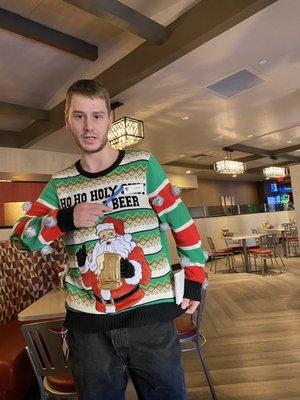 My waiter and the winner of the ugly sweater contest! Lol