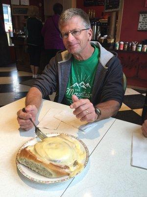 Eating at Daily Grind. Cinnamon roll!
