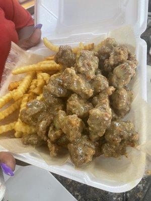 2lbs of Fried Turkey Knuckles w/Parmesan Sauce and fries. Best Turkey knuckles in town. Come check them out.