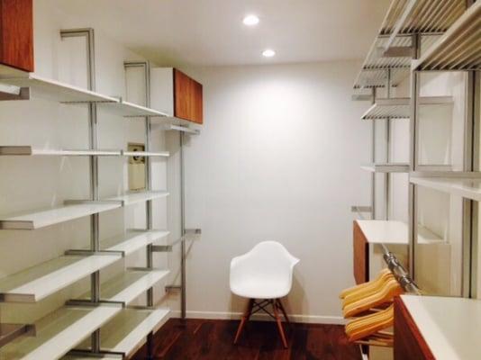 Wow - what a cool modern closet system. It's so clean and simple. We love how you can add cabinets and extra shoe shelves.