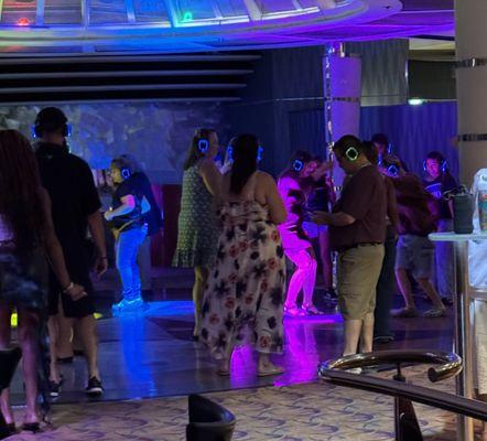 Silent disco. You dance to whatever you hear in your headphones.