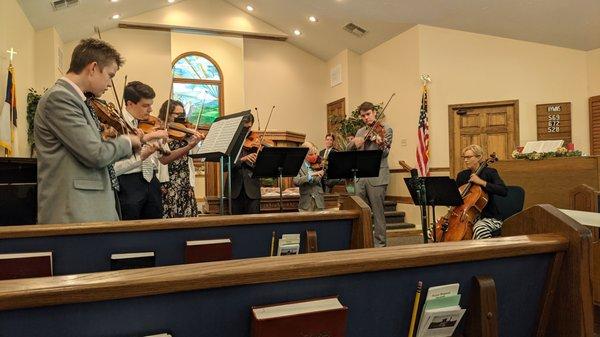 Music group practicing for church service.