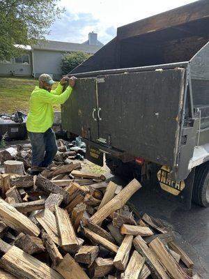 Finishing the day delivering seasoned firewood for our client to heat their house.