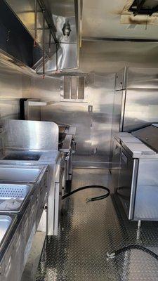 Inside of our trailer. We have a char broiler, falt grill, 45 lb fryer, and a whole lot more