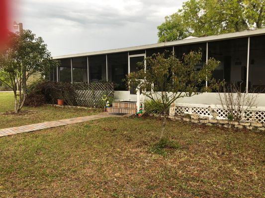 Screened in patio. Wraparound to back door with outside kitchen.