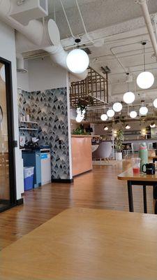 This is a photo of the printer, coffee, water, and front desk areas; the communal space at WeWork Pasadena.
