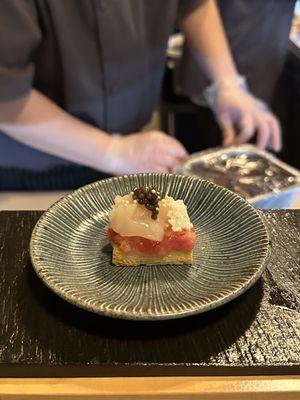 Buttered toast with toro, charred onion, scallop, and caviar