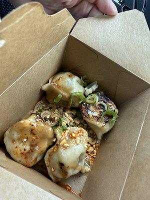 We got it to go so this what it looks like in the box. Chicken and Thai basil dumplings.