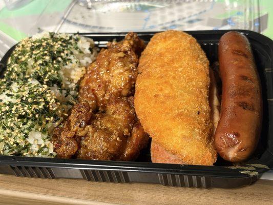 Fatboy bento- fried fish, hot dog, Teri beef, 2 garlic chicken thighs, slice spam, and 2 scoops rice.