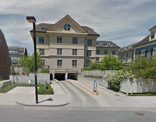 A view of the garage entrance and exit from the street.