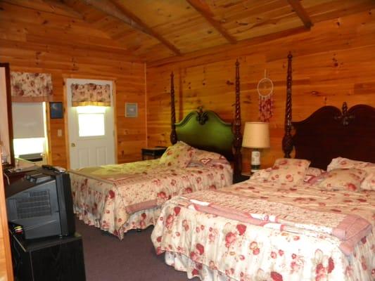 Two queen beds at the Wolf Cottage.