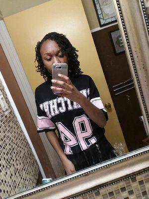 This is my one of my teenaged sweetie pies with her interlocked hair worm in a braidout!