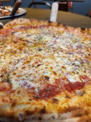 An off menu specialty pizza, with no mushrooms. Cheese, onion, basil and olive oil.