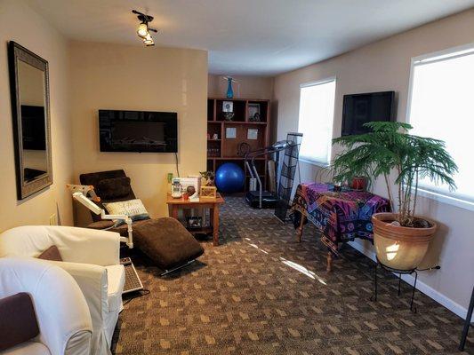 Relax in cozy comfortable waiting room with Pen Cove views.