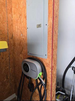 New EV car charger in garage