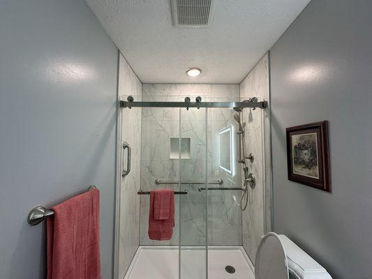 Finished shower with barn doors