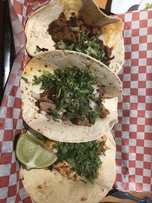 Pollo, chorizo and Carnitas tacos.
