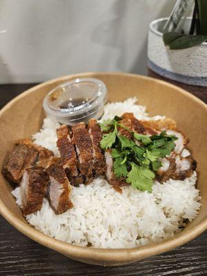 Crispy pork belly over rice