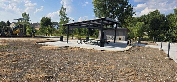 Playground, picnic tables and two bathrooms