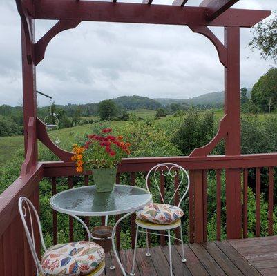 Enjoy your morning coffee on the panoramic deck shaded with a new pergola.